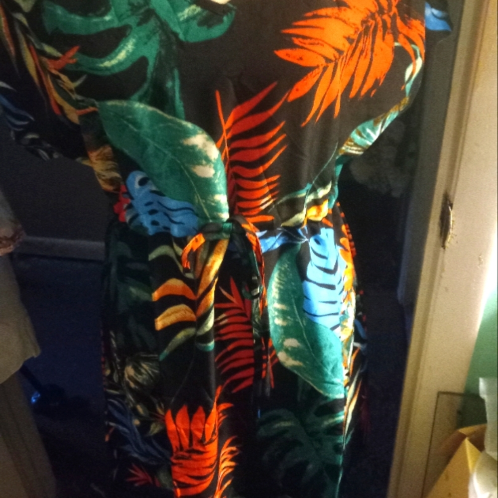 New with tag black background tropical leaf print beach cover-up size medium.